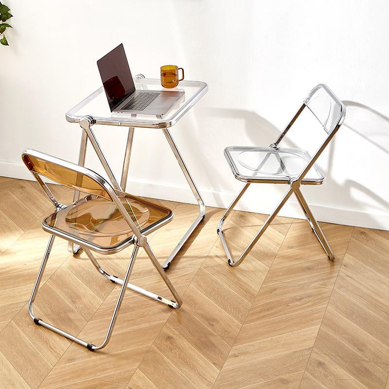 Nordic style transparent acrylic and metal frame folding dining chairs save space and are suitable for use in restaurants